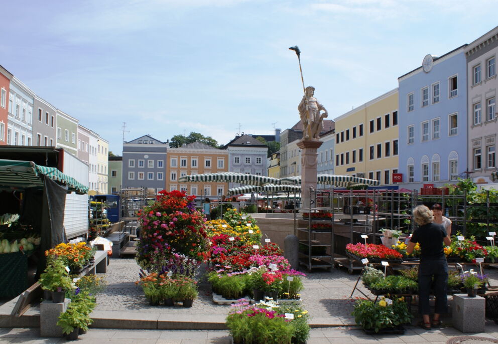 The green market on the main square of Ried, surrounded by historic buildings
